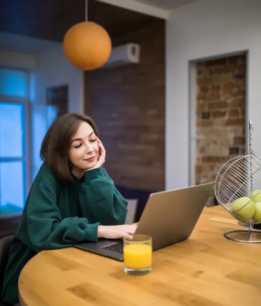 Client working remotely from her kitchen table